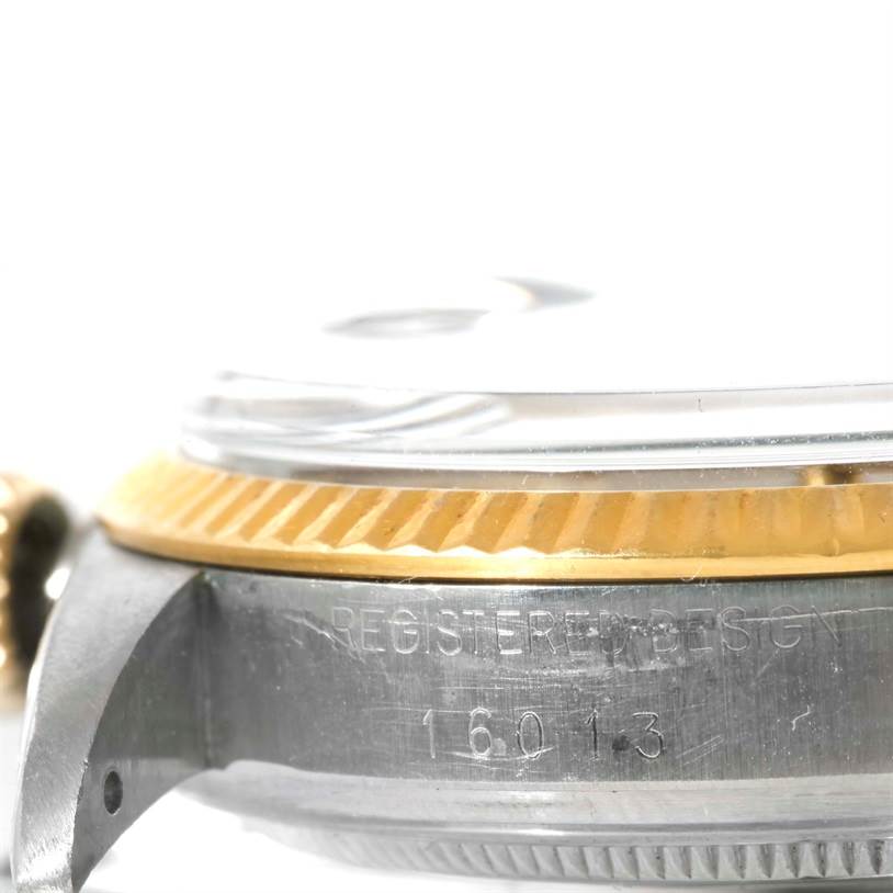 This image shows a close-up side view of the case and bezel of the Rolex Vintage Collection 16013 Men's Stainless Steel Champagne Dial 16013 Men's Stainless Steel Champagne Dial model 16013.