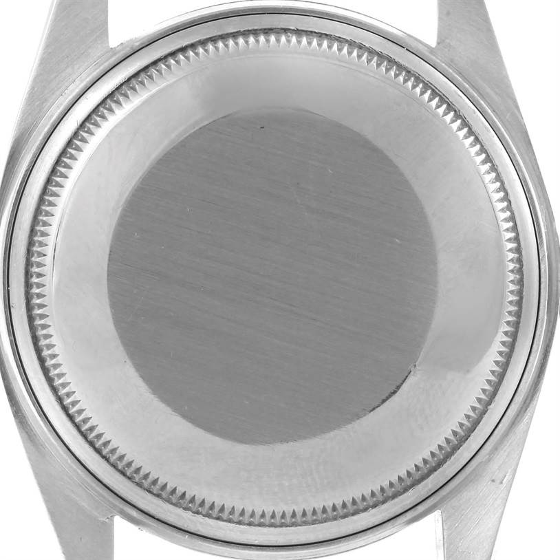 This image shows the back case of a Vintage Collection Rolex watch from a top-down angle.