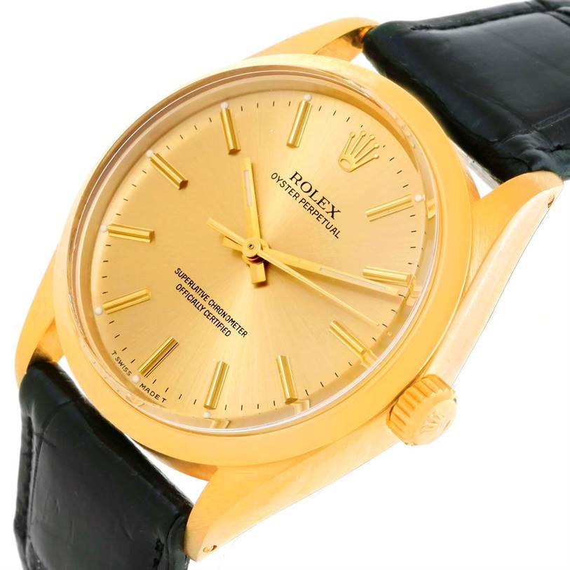 This image shows a side-angle view of the Vintage Collection Rolex Oyster Perpetual watch, highlighting the gold case, dial, and crown.