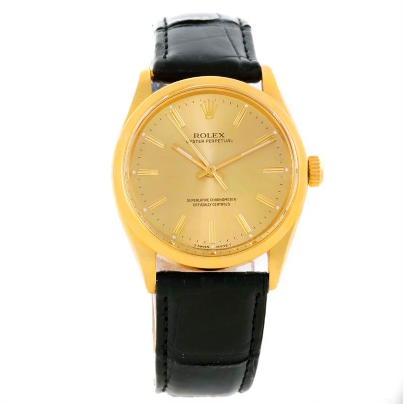 The image shows a frontal view of the Rolex Vintage Collection 1002 Men's Yellow Gold Champagne Dial 1002 Men's Yellow Gold Champagne Dial watch with a gold case and black leather strap.