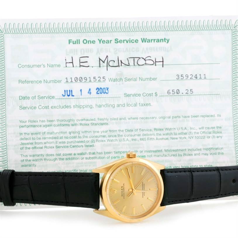 The image shows a Rolex Vintage Collection 1002 Men's Yellow Gold Champagne Dial 1002 Men's Yellow Gold Champagne Dial watch with a gold face and black leather strap, alongside its service warranty document.