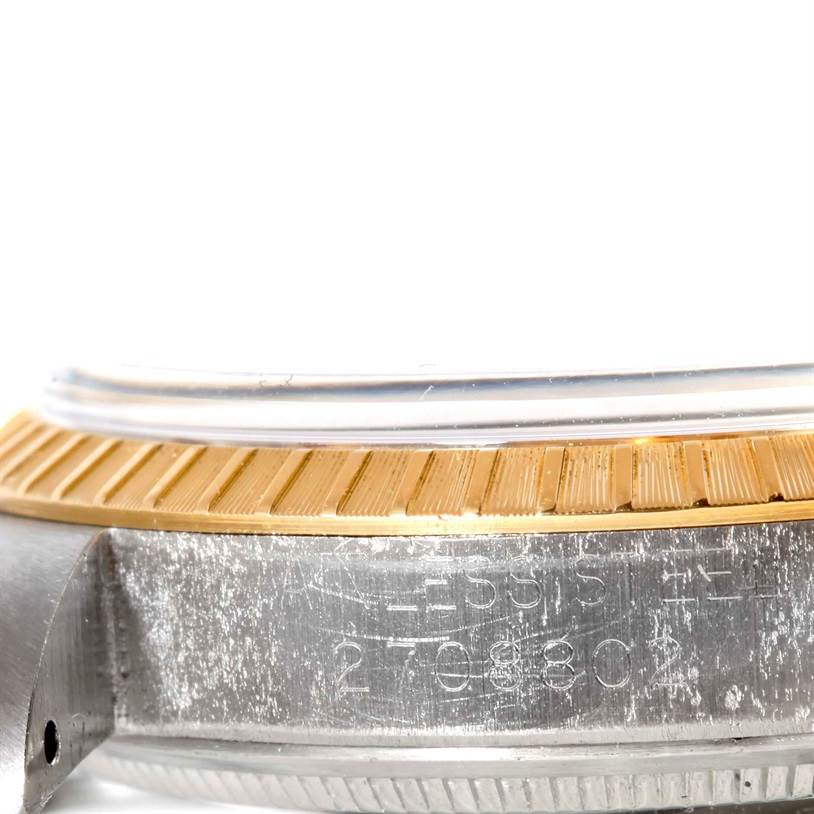 This image shows a close-up of the side profile and bezel of the Rolex Vintage Collection 1505 Men's Yellow Gold Champagne Dial 1505 Men's Yellow Gold Champagne Dial model watch.
