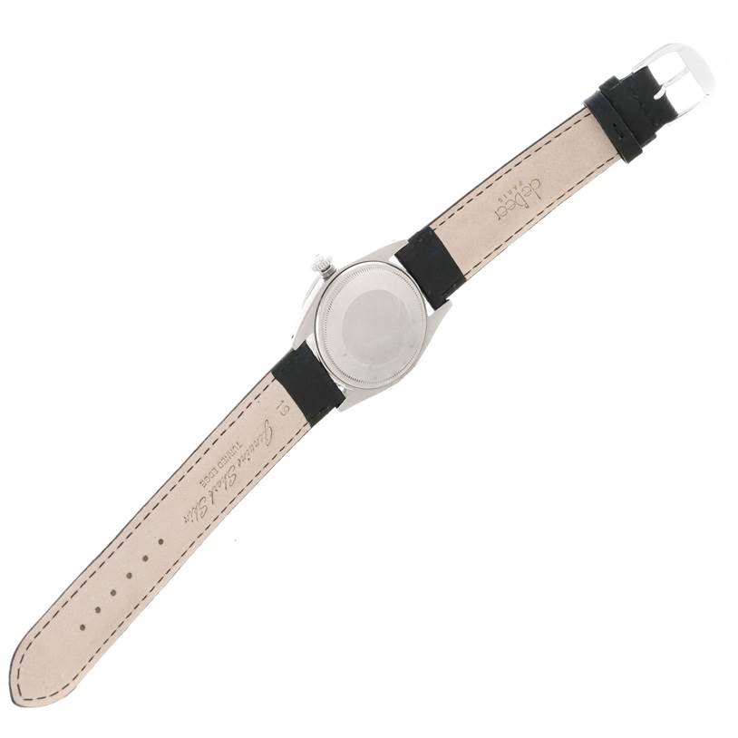 The image shows the back view of a Vintage Collection Rolex watch, displaying the case back and leather strap.