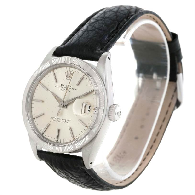 The image shows a side angle of the Rolex Vintage Collection 1501 Men's Stainless Steel Silver Dial 1501 Men's Stainless Steel Silver Dial watch, highlighting the dial, bezel, crown, and black leather strap.