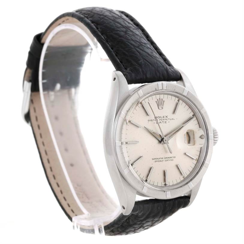 The image shows a side view of the Rolex Vintage Collection 1501 Men's Stainless Steel Silver Dial 1501 Men's Stainless Steel Silver Dial watch, highlighting its face, bezel, crown, and black leather strap.