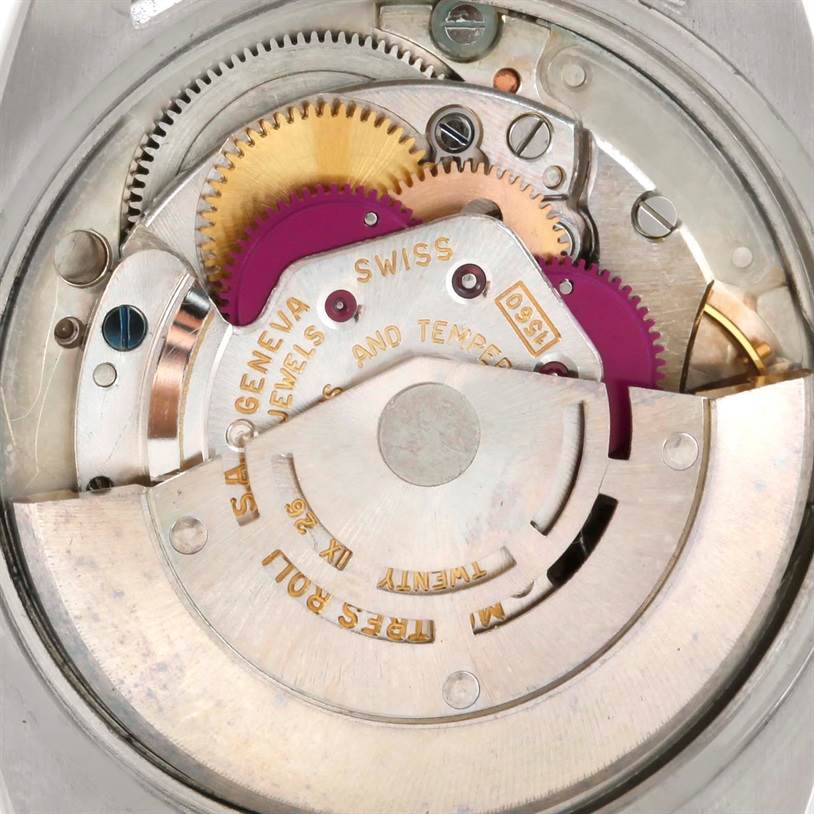 This close-up image shows the inner mechanism of a Vintage Collection model by Rolex, highlighting gears and movement parts.