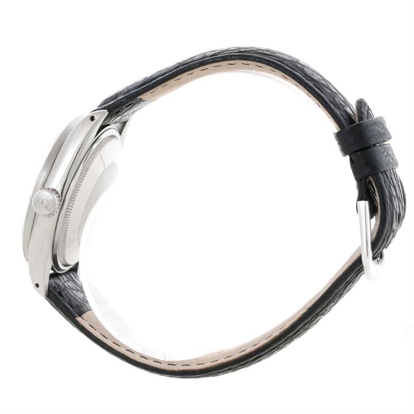 The image shows a side profile of the Rolex Vintage Collection 1501 Men's Stainless Steel Silver Dial 1501 Men's Stainless Steel Silver Dial watch, highlighting the case, crown, and leather strap.