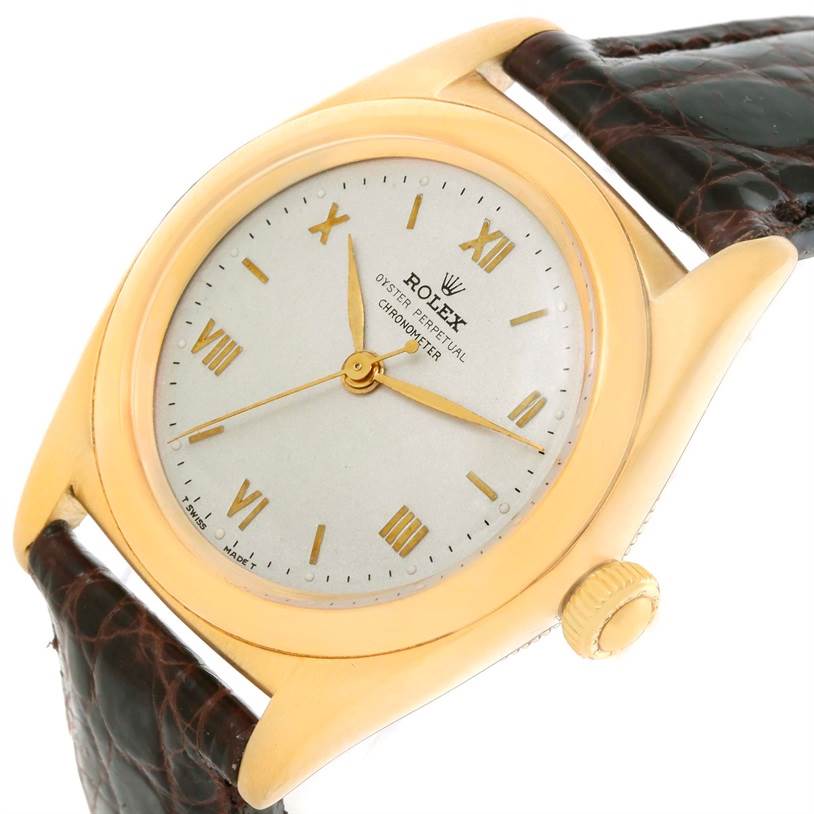 The image shows a close-up angle of a Rolex Vintage Collection 3131G Men's Yellow Gold Silver Dial 3131G Men's Yellow Gold Silver Dial watch, highlighting the dial, hands, crown, and part of the leather strap.