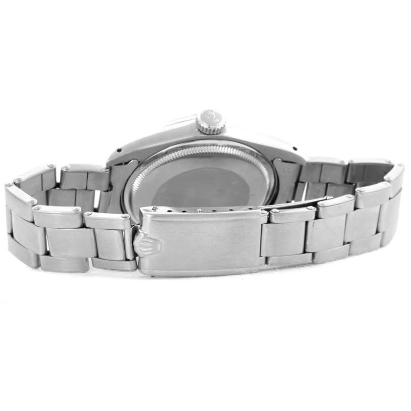 This image shows the back case and open clasp of the Vintage Collection model by Rolex, revealing its bracelet links and crown.