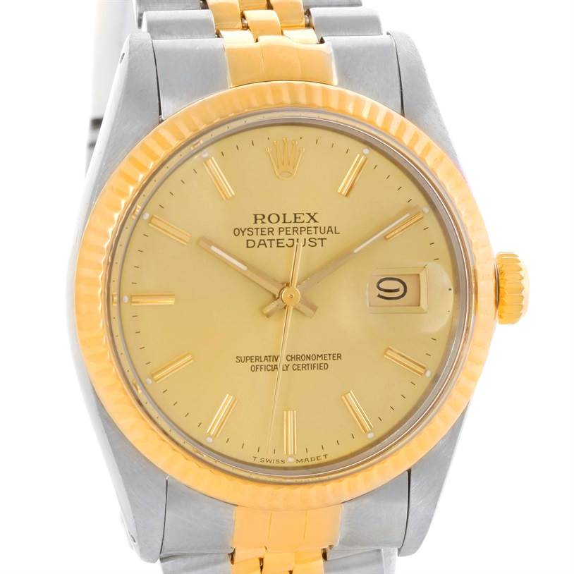 The image shows a front view of the Rolex Vintage Collection 16013 Men's Stainless Steel Champagne Dial 16013 Men's Stainless Steel Champagne Dial Datejust watch, showcasing its dial, bezel, and part of the band.