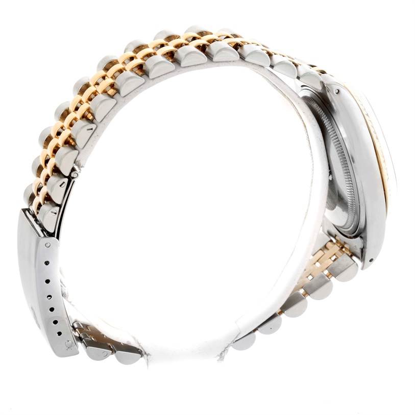 This image shows a side view of a Rolex Vintage Collection 16013 Men's Stainless Steel Champagne Dial 16013 Men's Stainless Steel Champagne Dial model, highlighting its two-tone metal bracelet and clasp.