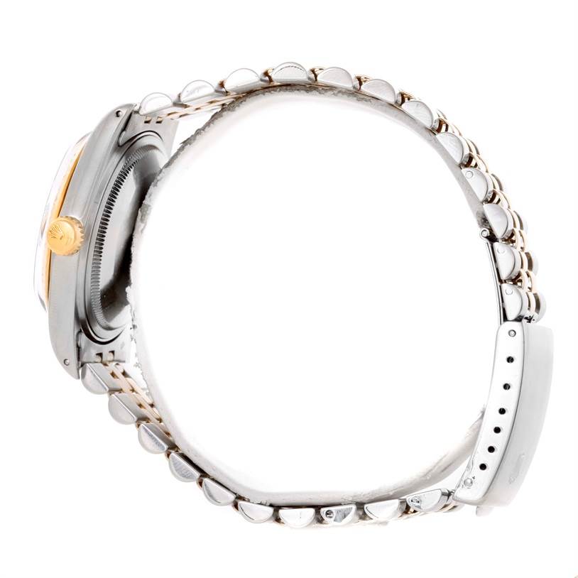 This image shows a side view of the Rolex Vintage Collection 16013 Men's Stainless Steel Champagne Dial 16013 Men's Stainless Steel Champagne Dial model, displaying the crown, case, and part of the bracelet.