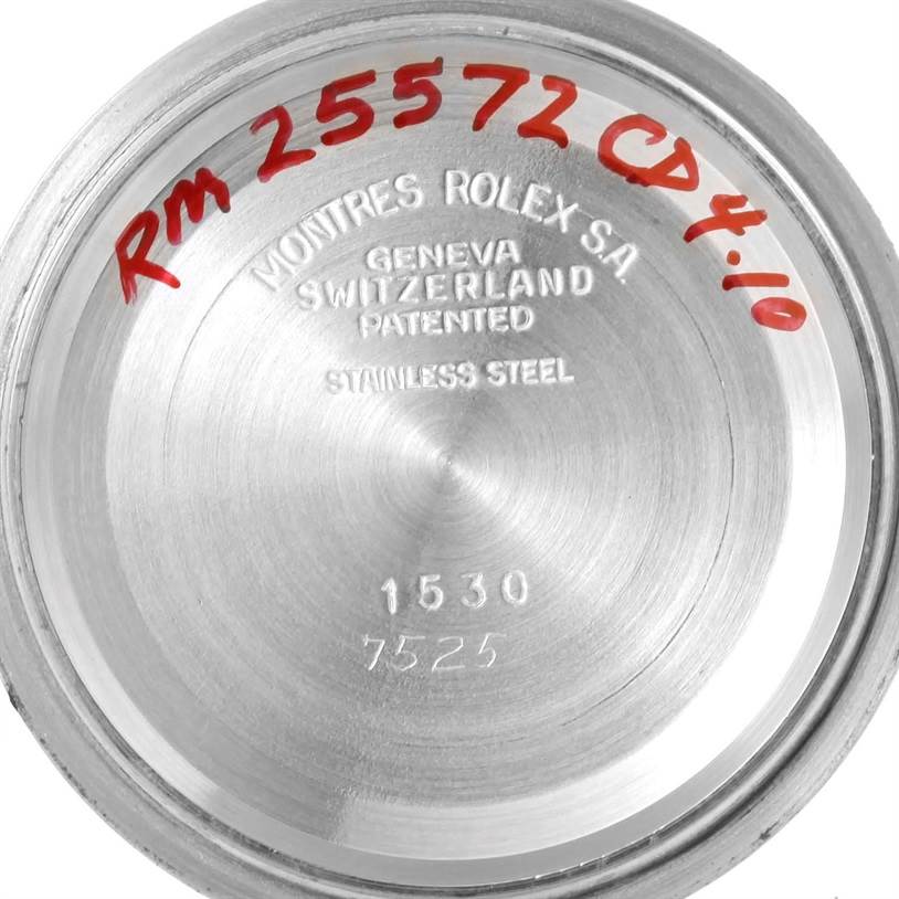 The image shows the inner case back of a Rolex Vintage Collection 1530 Men's Stainless Steel Silver Dial 1530 Men's Stainless Steel Silver Dial watch, with engraved and written markings.