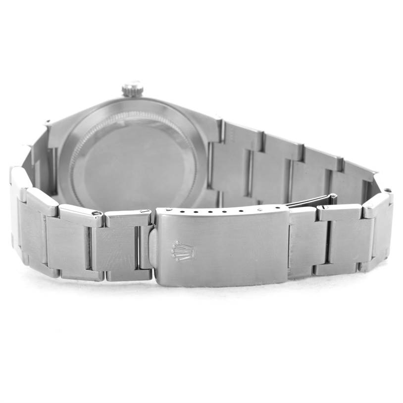 The image shows the case back, bracelet, and clasp of a Vintage Collection Rolex watch from a rear angle.