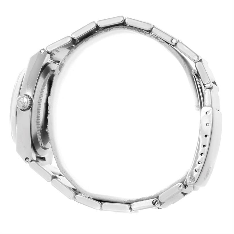 This image shows a side view of the Rolex Vintage Collection 1530 Men's Stainless Steel Silver Dial 1530 Men's Stainless Steel Silver Dial watch, highlighting the crown and bracelet links.