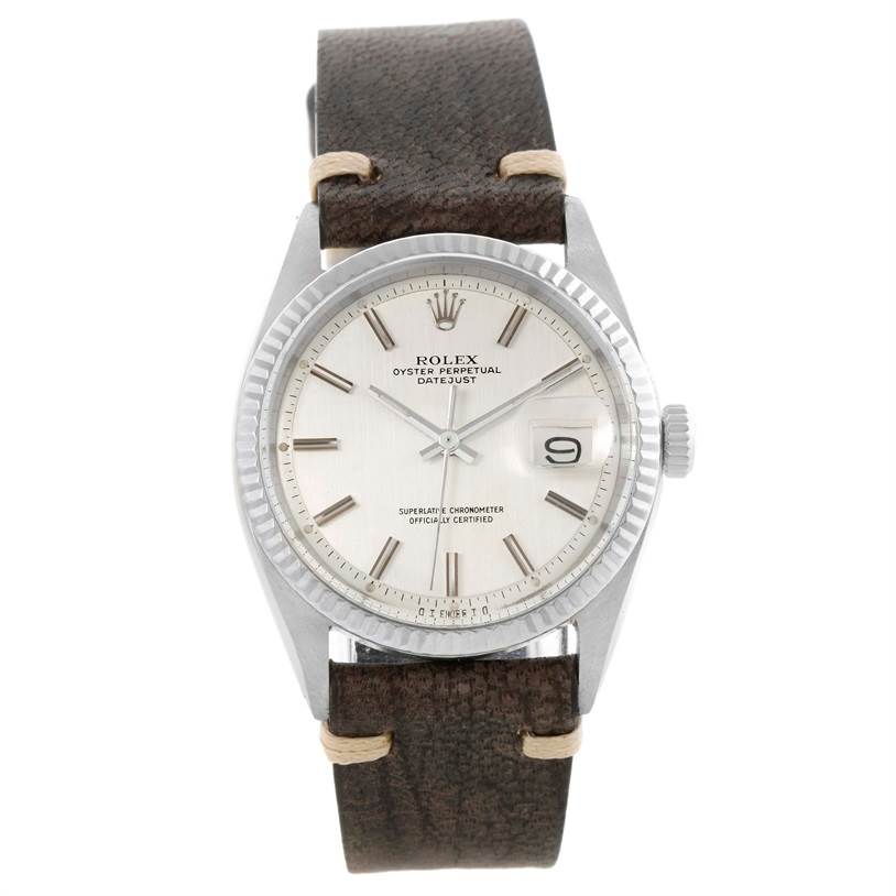 The Vintage Collection Rolex watch is shown from a front angle, displaying its round dial, date window, and leather strap.