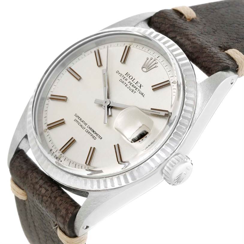 The Rolex Vintage Collection 1601 Men's Stainless Steel Silver Dial 1601 Men's Stainless Steel Silver Dial watch is shown from a slight angled top view, highlighting the face, crown, and leather strap.