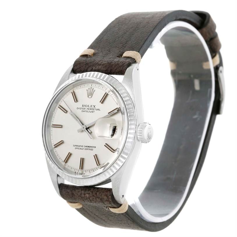 The Vintage Collection Rolex watch is shown at a slight angle, highlighting its face, bezel, and leather strap.