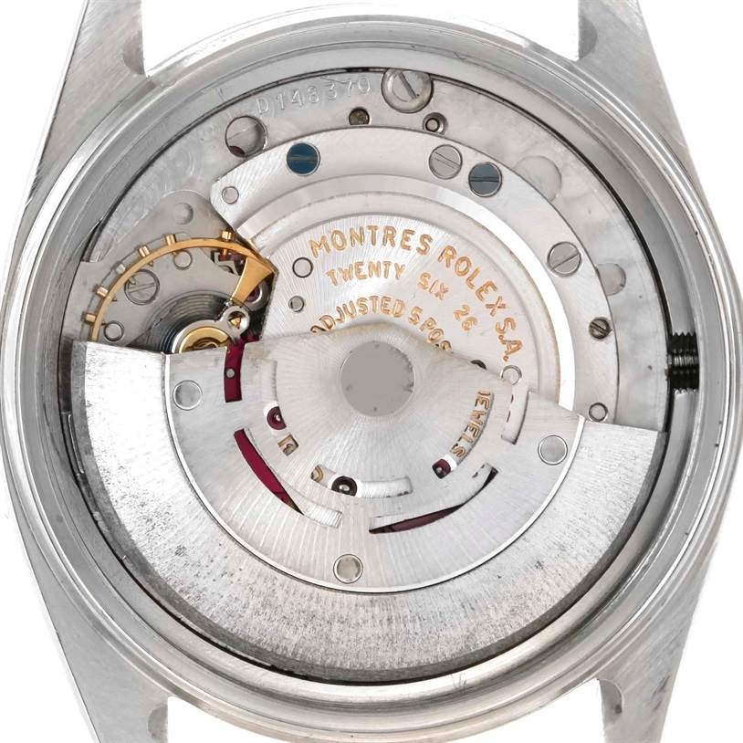 This Vintage Collection Rolex watch is shown from the back, displaying its intricate mechanical movement.