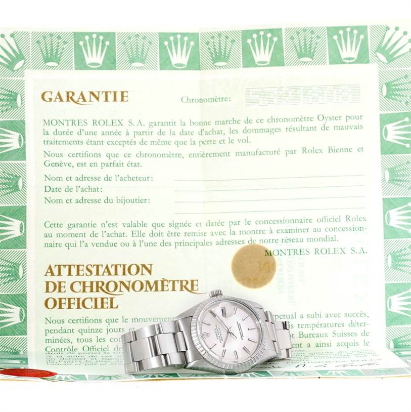 The image shows a Rolex Vintage Collection 1603 Men's Stainless Steel Silver Dial 1603 Men's Stainless Steel Silver Dial watch with its bracelet laid out in front of the official warranty certificate.