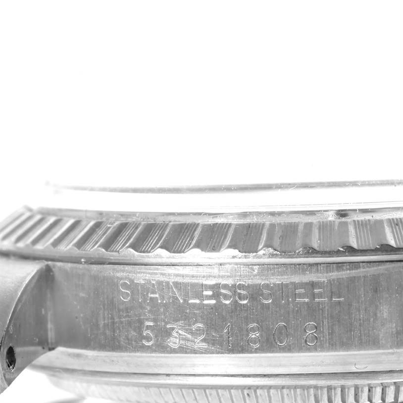 The image shows a side view of a Rolex Vintage Collection 1603 Men's Stainless Steel Silver Dial 1603 Men's Stainless Steel Silver Dial watch case, highlighting the stainless steel material and partial serial number.