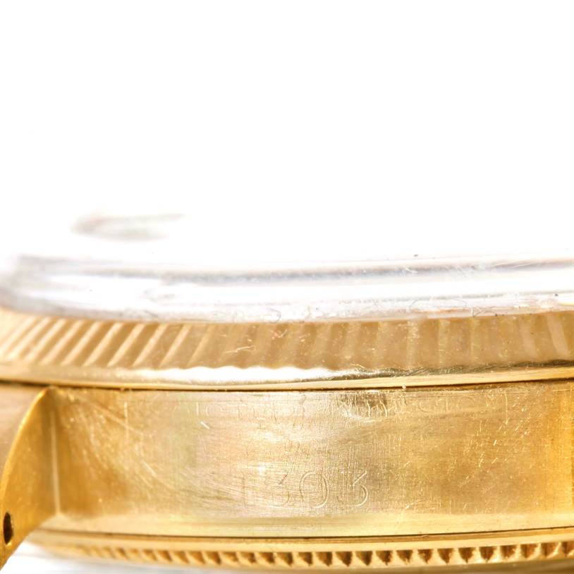 This image shows a close-up side view of the bezel and case of a Vintage Collection model by Rolex.