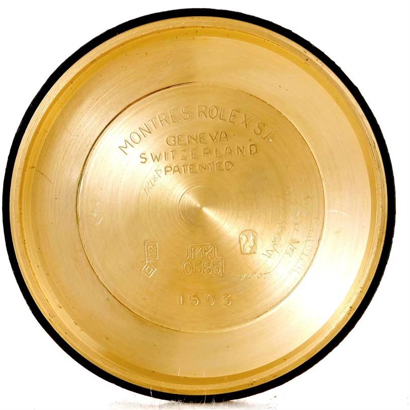 This image shows the inner case back of a Vintage Collection model by Rolex, displaying various engravings and hallmarks.