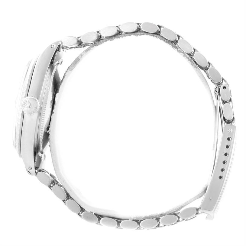 The image shows the side view and bracelet of a Rolex Vintage Collection 1603 Men's Stainless Steel Silver Dial 1603 Men's Stainless Steel Silver Dial watch, highlighting the crown and clasp.