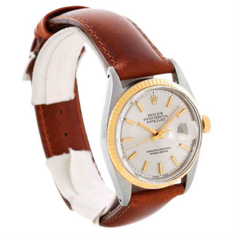 The image shows a Rolex Vintage Collection 1601 Men's Stainless Steel Silver Dial 1601 Men's Stainless Steel Silver Dial model watch from a three-quarter angle, highlighting its face, bezel, crown, and leather strap.