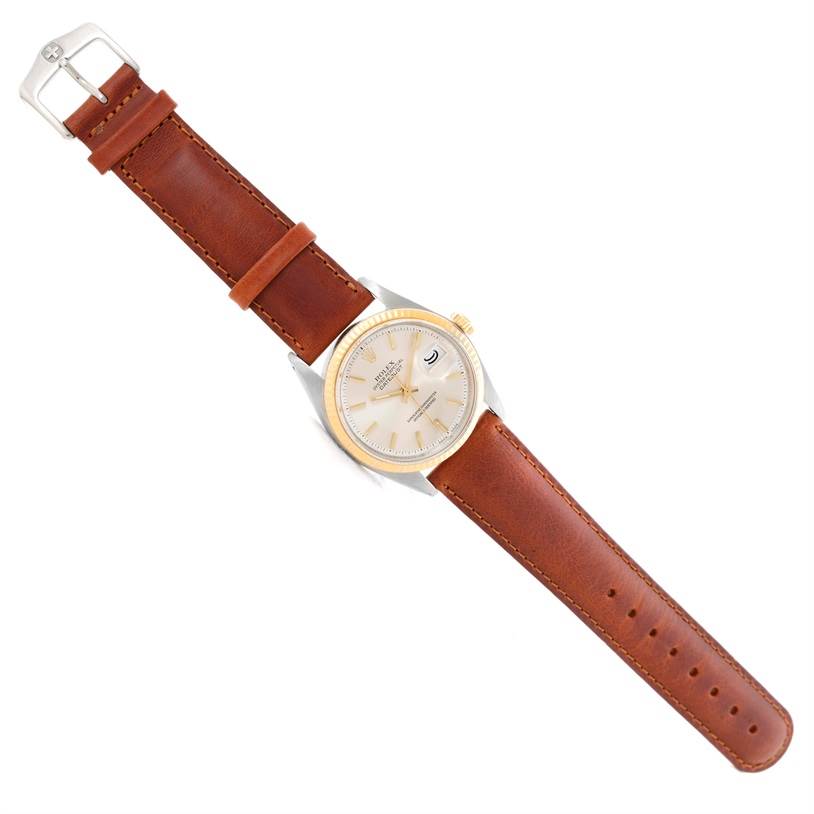 This image shows a top view of the Rolex Vintage Collection 1601 Men's Stainless Steel Silver Dial 1601 Men's Stainless Steel Silver Dial watch with a brown leather strap fully extended.