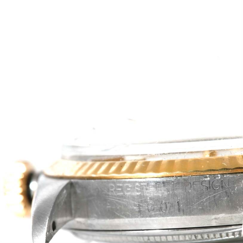 The image shows a side angle of the Rolex Vintage Collection 1601 Men's Stainless Steel Silver Dial 1601 Men's Stainless Steel Silver Dial watch, focusing on the crown, bezel, and part of the case with engraving.