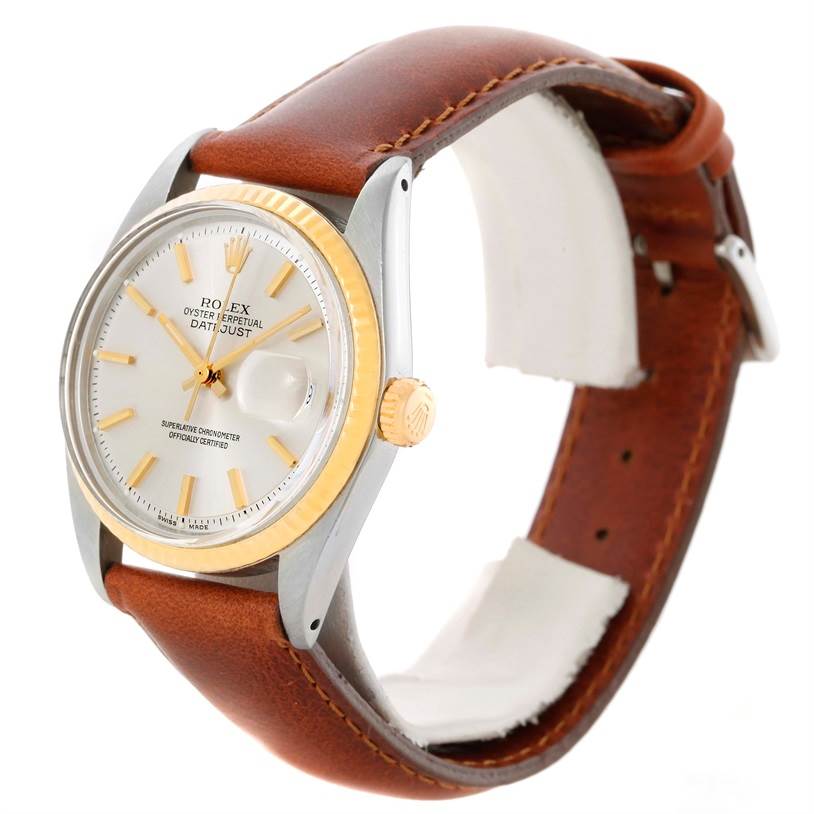 The Rolex Vintage Collection 1601 Men's Stainless Steel Silver Dial 1601 Men's Stainless Steel Silver Dial model watch is shown at an angle highlighting its face, bezel, and brown leather strap.
