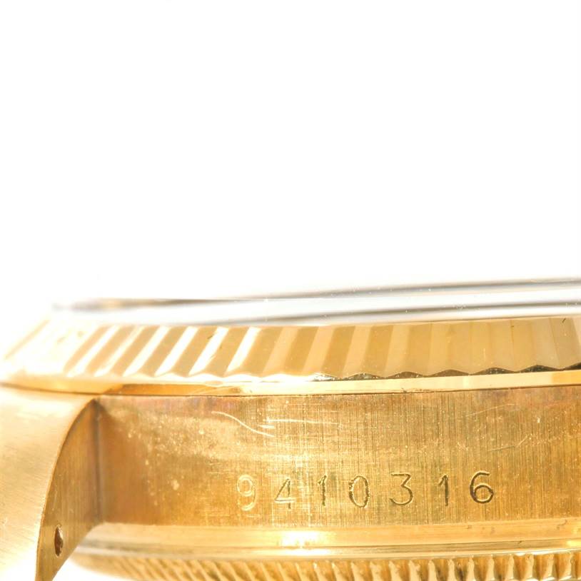 This image shows the side view of the casing and bezel of a Rolex Vintage Collection 15037 Men's Yellow Gold Black Dial 15037 Men's Yellow Gold Black Dial watch, featuring a serial number.