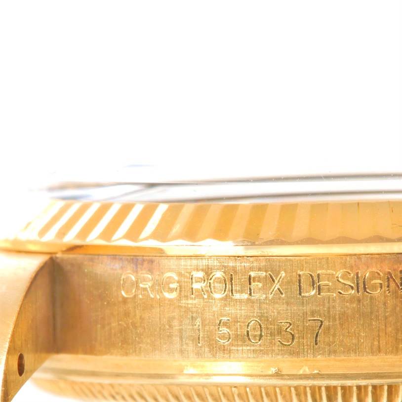 This close-up image of the Rolex Vintage Collection 15037 Men's Yellow Gold Black Dial 15037 Men's Yellow Gold Black Dial model shows the engraved case with the model number 15037 and a portion of the bezel.