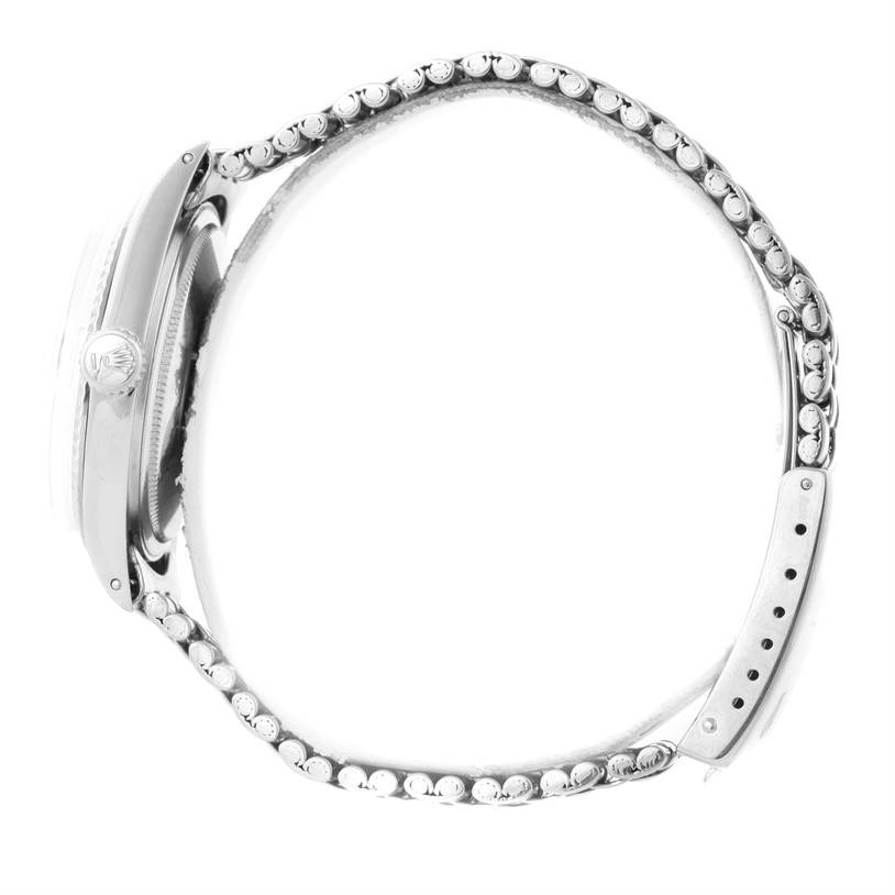 The image shows a side view of the Rolex Vintage Collection 1601 Men's Stainless Steel Silver Dial 1601 Men's Stainless Steel Silver Dial watch, highlighting its profile, casing, crown, and partially opened bracelet.