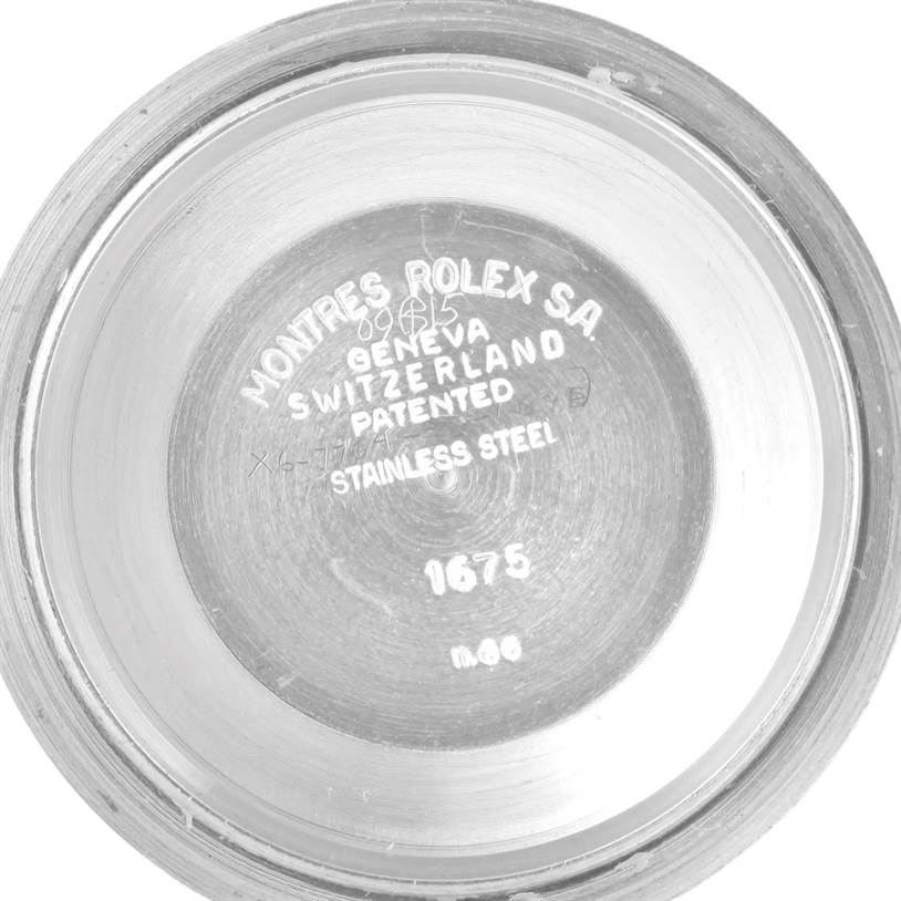 This image shows a close-up view of the inner case back of the Vintage Collection model 1675 by Rolex.