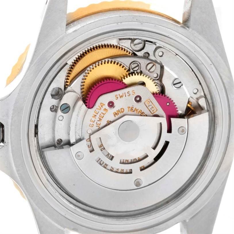 The image shows the internal mechanism of the Rolex Vintage Collection 1675 Men
s Stainless Steel Brown Dial 1675 Men
s Stainless Steel Brown Dial watch from a rear angle, revealing its gears and components.