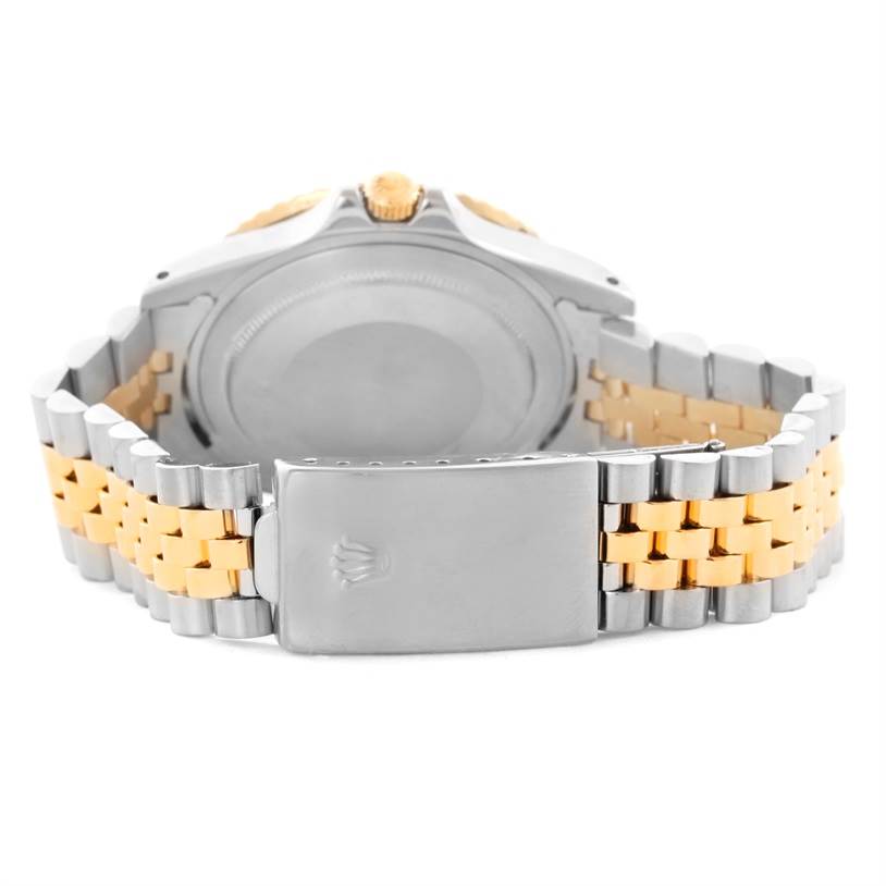 The image shows the back view of the Vintage Collection model by Rolex, highlighting the case back and bracelet clasp.