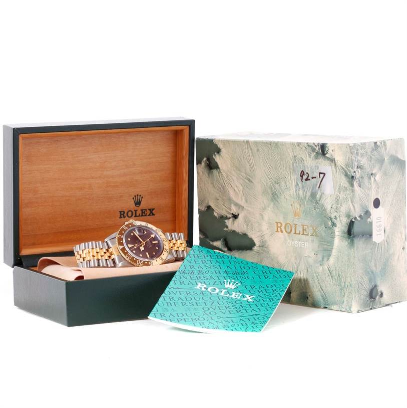 The Rolex Vintage Collection 1675 Men
s Stainless Steel Brown Dial 1675 Men
s Stainless Steel Brown Dial watch is shown at an angle displaying its case, bracelet, and dial, along with its box and papers.