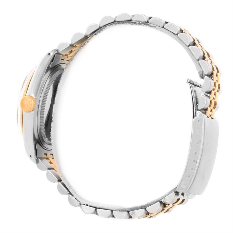 This image shows the Rolex Vintage Collection 16013 Men's Stainless Steel Black Dial 16013 Men's Stainless Steel Black Dial watch from a side angle, featuring its crown, case, and bracelet.