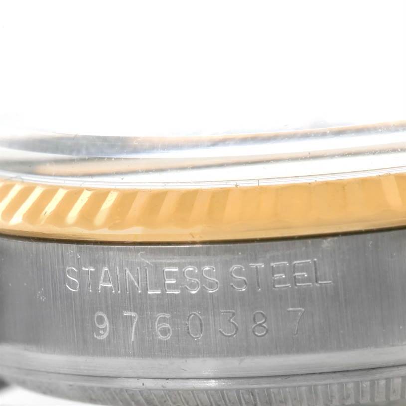 This close-up image shows the stainless steel case and bezel of a Vintage Collection Rolex watch.