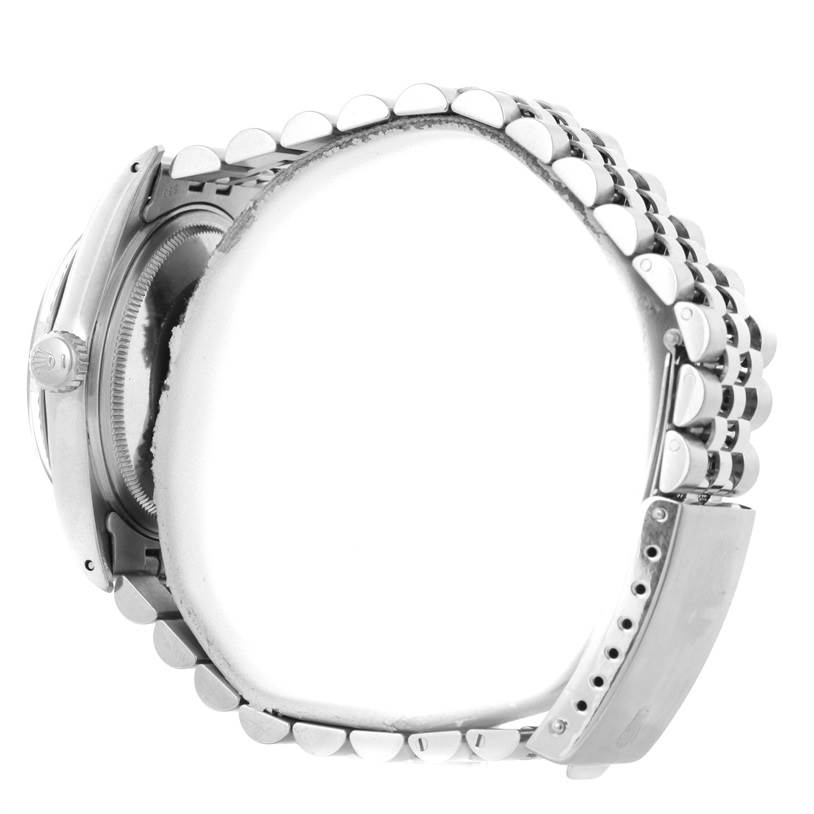 This image shows the side view of a Rolex Vintage Collection 16014 Men's Stainless Steel Silver Dial 16014 Men's Stainless Steel Silver Dial watch, focusing on the bracelet and crown.