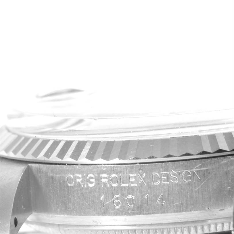 The image shows the side of a Vintage Collection Rolex watch, focusing on the bezel and engraved model number 16014.