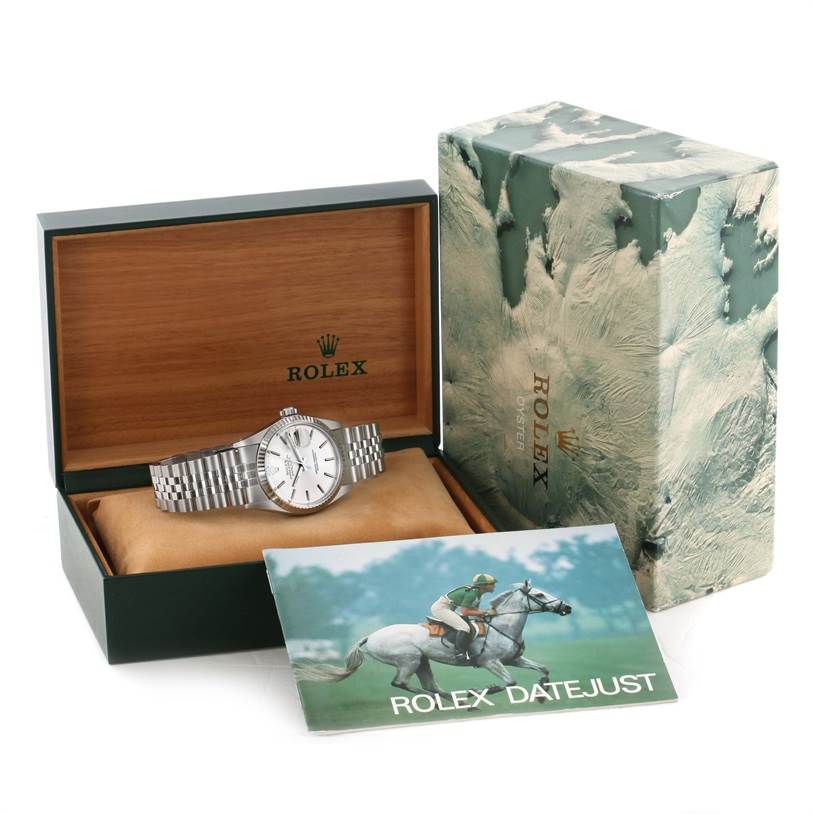 The image shows a Rolex Vintage Collection 16014 Men's Stainless Steel Silver Dial 16014 Men's Stainless Steel Silver Dial watch placed inside its open box, along with the outer box and a Rolex Datejust booklet.