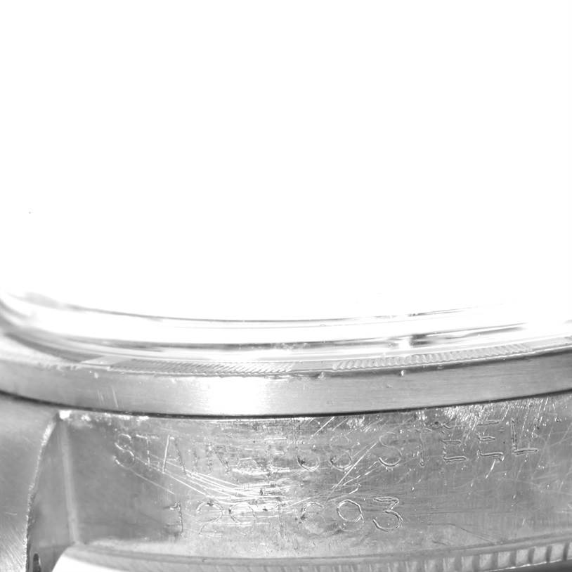 The image shows a close-up of the side casing of the Rolex Vintage Collection 1007 Men's Stainless Steel Silver Dial 1007 Men's Stainless Steel Silver Dial model watch, highlighting the stainless steel text.