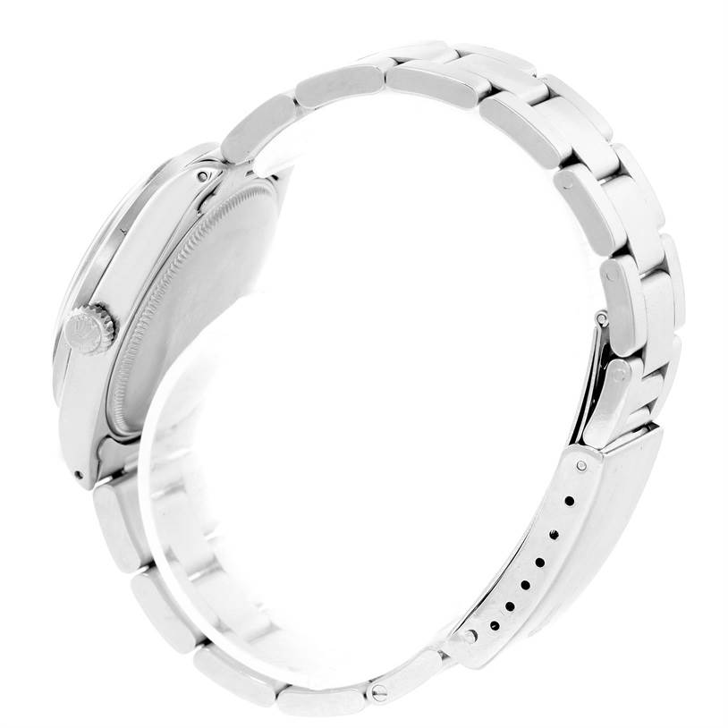 This is a side-angle view of a Rolex Vintage Collection 1007 Men's Stainless Steel Silver Dial 1007 Men's Stainless Steel Silver Dial watch, showing the side of the case and the bracelet.