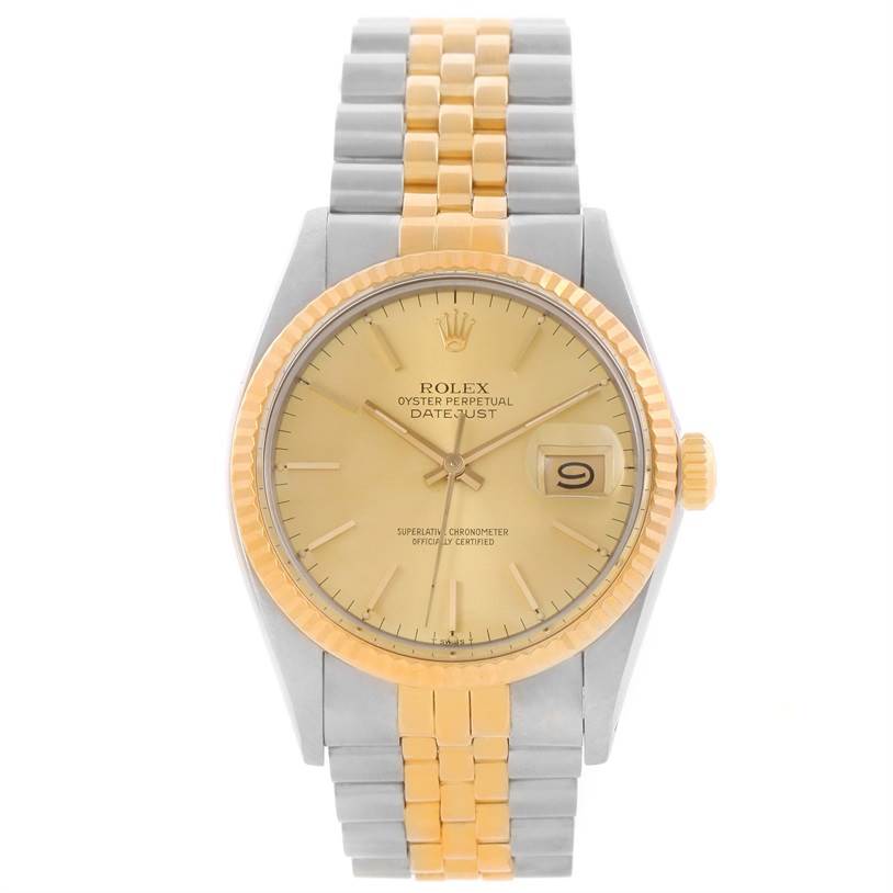 The image shows a front view of a Rolex Vintage Collection 16013 Men
s Stainless Steel Champagne Dial 16013 Men
s Stainless Steel Champagne Dial Datejust watch featuring a gold dial and two-tone bracelet.