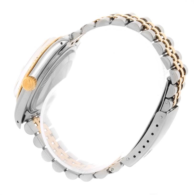 This image shows a side angle of a Rolex Vintage Collection 16013 Men
s Stainless Steel Champagne Dial 16013 Men
s Stainless Steel Champagne Dial watch, highlighting its bracelet and crown.