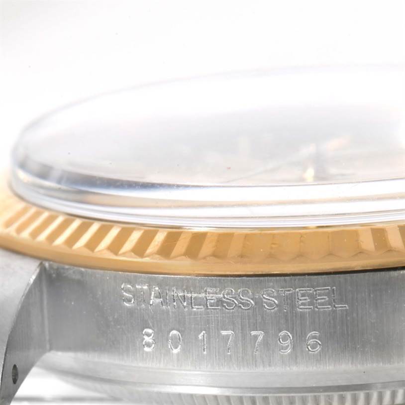 This image shows a close-up of the side view of a Rolex Vintage Collection 16013 Men
s Stainless Steel Champagne Dial 16013 Men
s Stainless Steel Champagne Dial watch case, showcasing the bezel and part of the crystal.