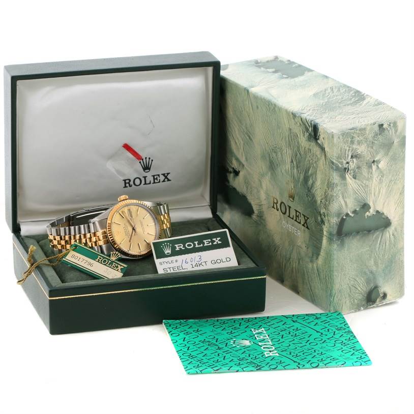 The image shows a Rolex Vintage Collection 16013 Men
s Stainless Steel Champagne Dial 16013 Men
s Stainless Steel Champagne Dial watch, visible inside its open box, with accompanying tags and certificates.
